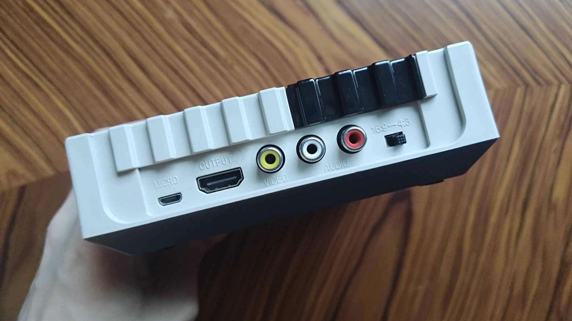Back of Hyperkin Retron HD with HDMI, RCA composite, aspect ration switch, and micro USB power port in view.