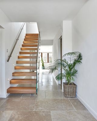Cantilevered timber staircase from Jarrods in modern hallway
