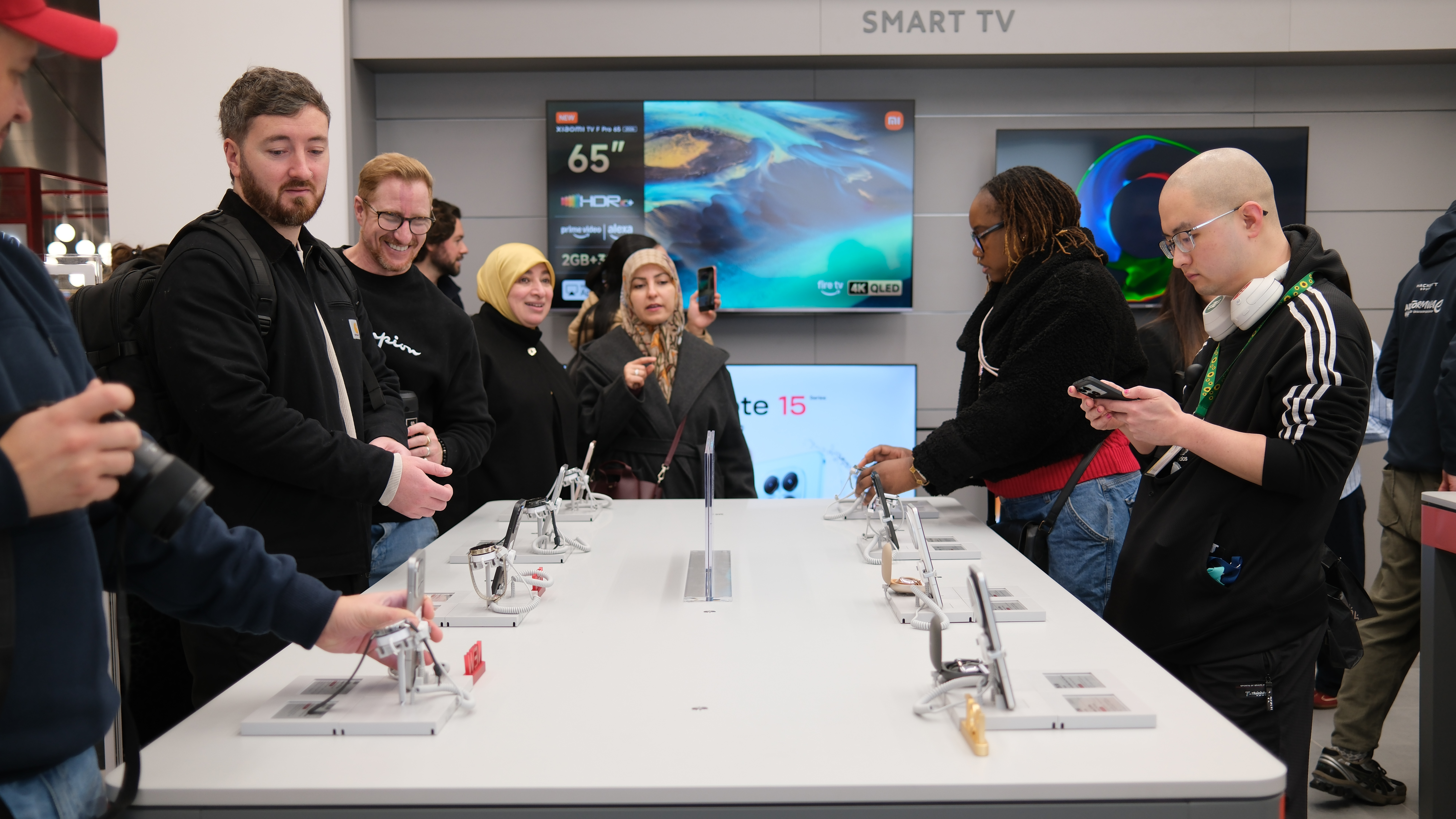 Customer's trying out Xiaomi phones at its London Stratford Westfield store