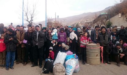 Residents of Madaya, Syria, wait for humanitarian aid.
