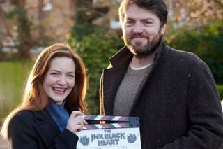 Robin Ellacott (HOLLIDAY GRAINGER), Cormoran Strike (TOM BURKE)