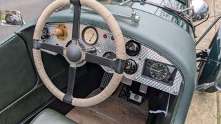 The rope braided steering wheel and period dash, complete with subtle digital display