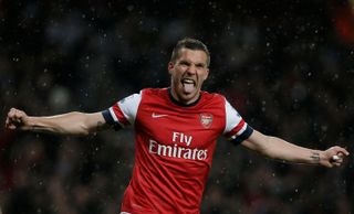 Lukas Podolski celebrates after scoring for Arsenal, 2013