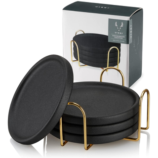 a set of black coasters in a holder