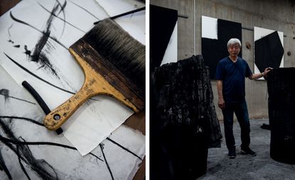 Lee Bae in his studio with charcoal sculptures