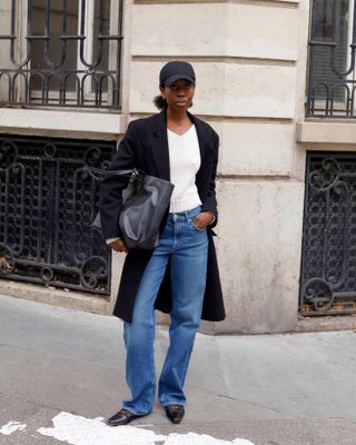 French girl wearing a V-neck sweater with jeans