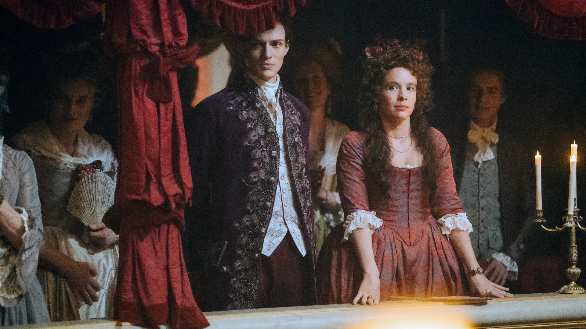 Chartres and Felicite watch the King's reaction in Marie Antoinette