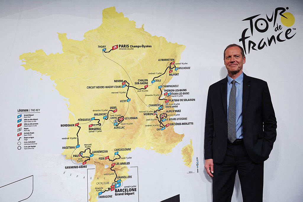 Tour de France General Director Christian Prudhomme poses for a picture in front of the map showing the women&#039;s route during the presentation of the official routes of the 2026 edition of the men&#039;s and women&#039;s Tour de France cycling race in Paris on October 23, 2025. (Photo by Anne-Christine POUJOULAT / AFP)