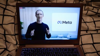 mark zuckerberg laptop screen meta logo