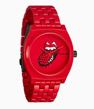 A red watch with a tongue sticking out of red lips on a red face with red hands.