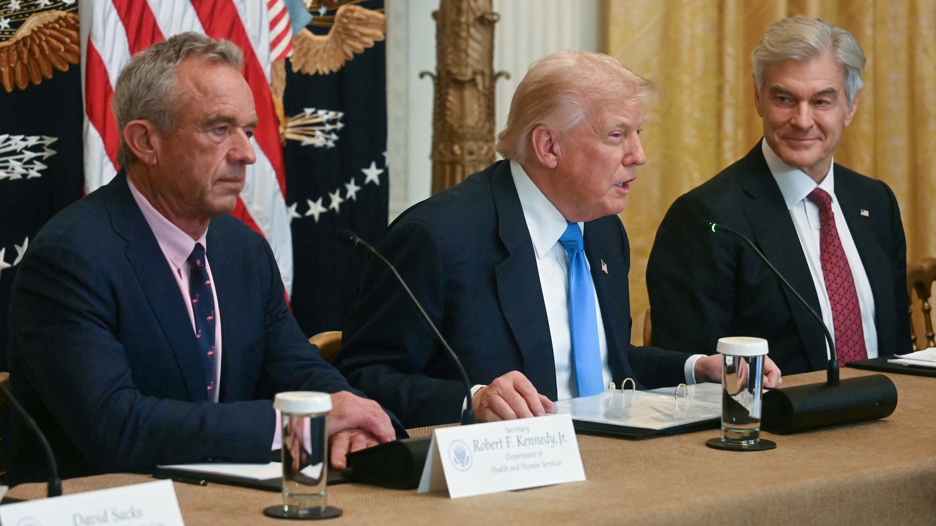 US Secretary of Health and Human Services Robert F. Kennedy Jr., US President Donald Trump and Medicare and Medicaid Administrator Mehmet Oz participate in an event on &quot;Making Health Technology Great Again,&quot; in the East Room of the White House in Washington, DC