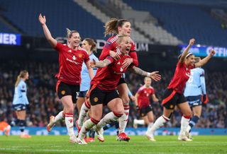 Leah Galton of Manchester United celebrates scoring her team's second goal with team mates during the Barclays Women's Super League match between Manchester City and Manchester United at Etihad Stadium on January 19, 2025 in Manchester, England.