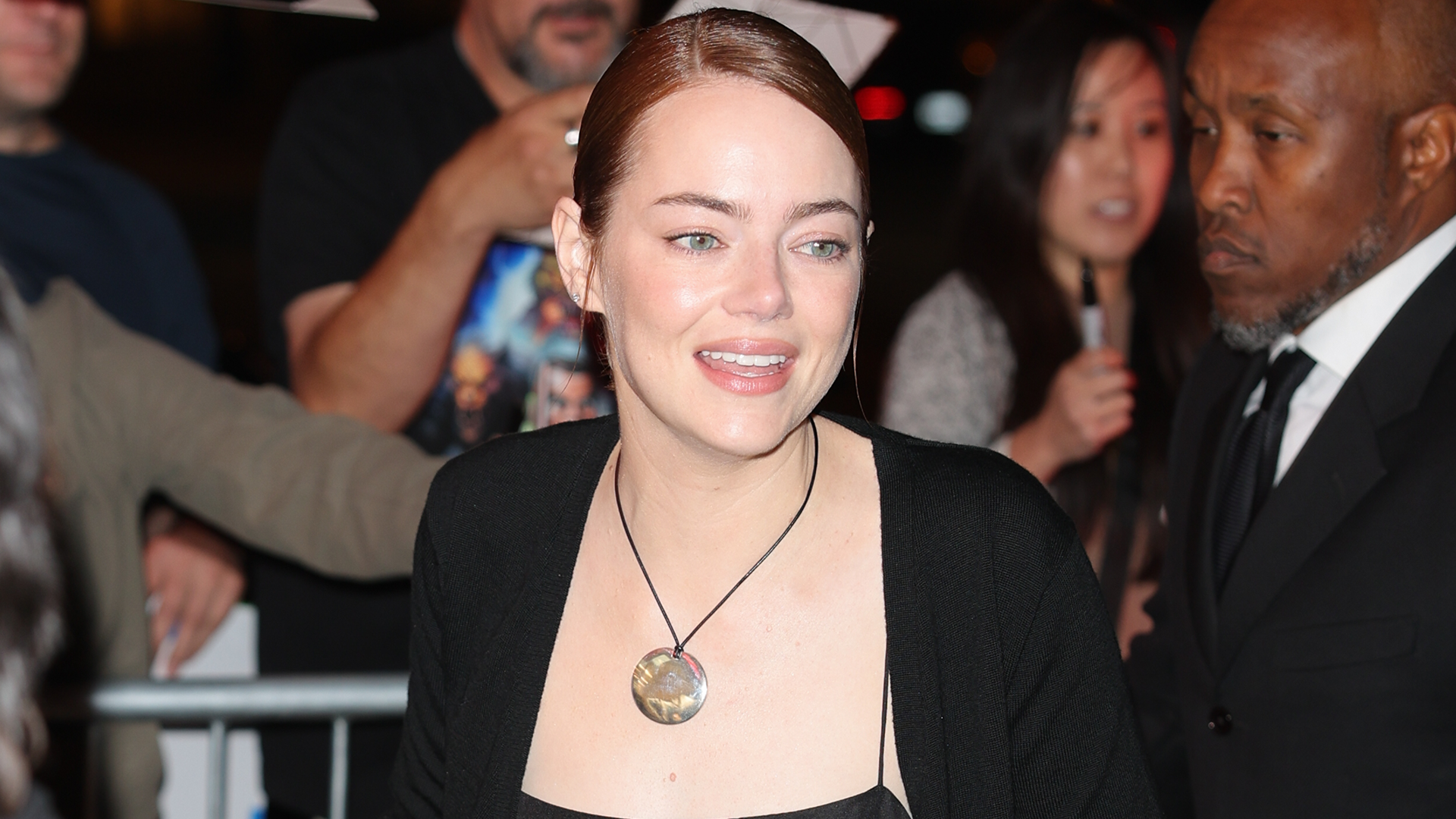 Emma Stone accessorized her all-black satin set with the cord necklace trend