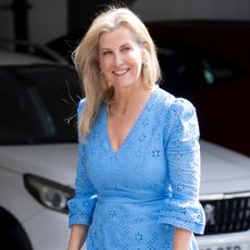 Duchess Sophie wearing a blue eyelet dress smiling