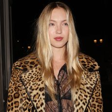 Lila Moss attends Beyoncé's 'Cowboy Carter' concert in cowboy boots and a Prada cowhide bag.