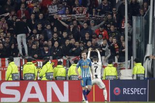 Cristiano Ronaldo celebrates in front of Atletico fans