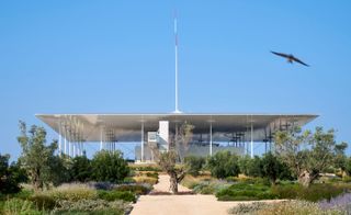 A photo of the Stavros Niarchos Foundation building surrounded by greenery.