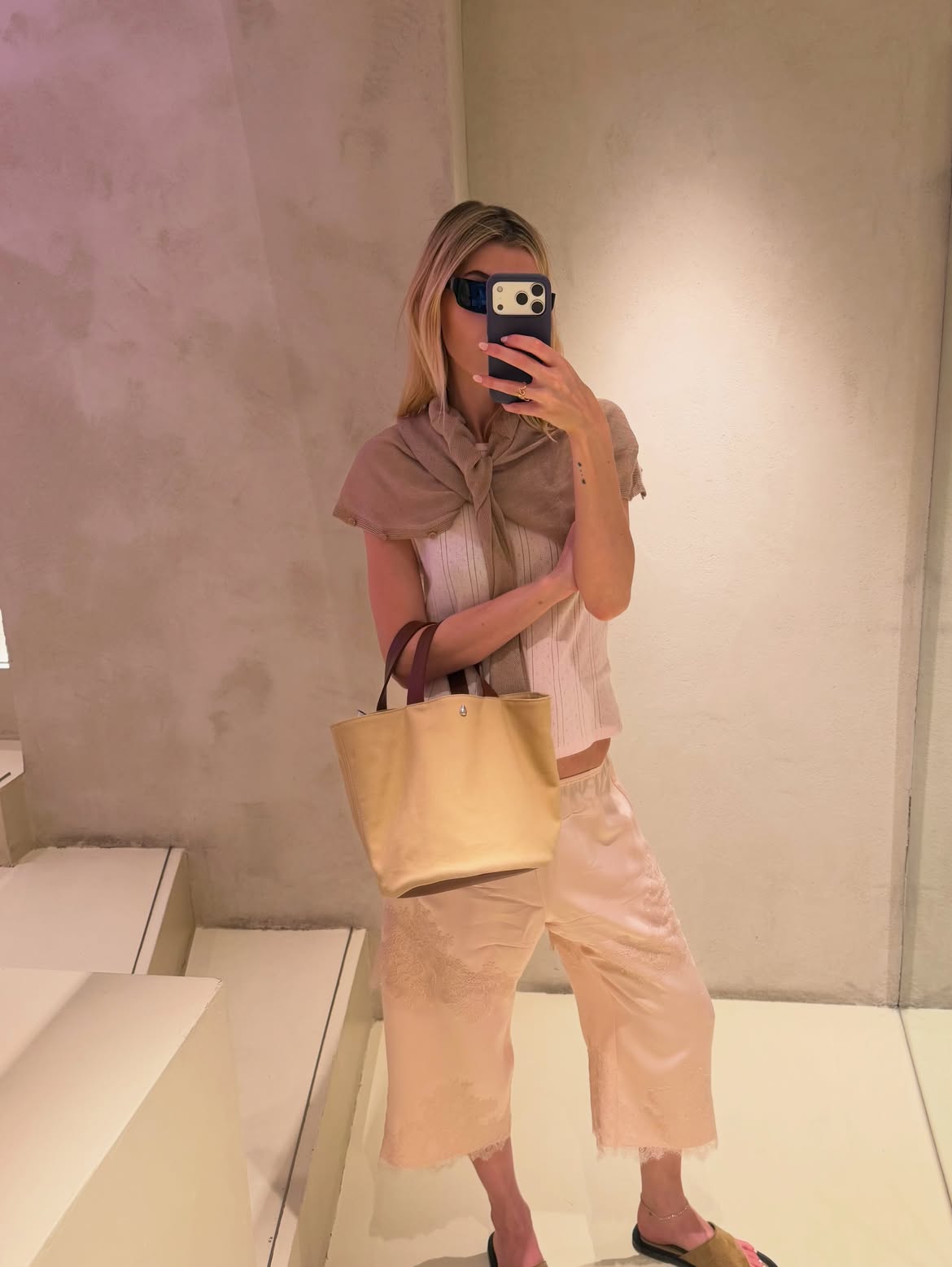 Evie Henderson wearing a pair of Aflalo silk Bermuda shorts