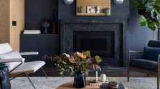 A contemporary living room painted in a charcoal shade