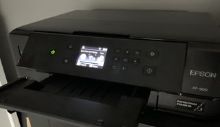 Epson printer with Wi-Fi settings showing on display
