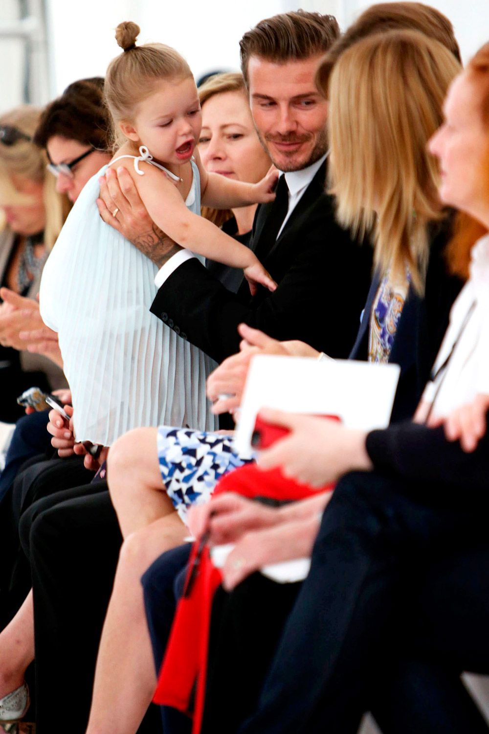 Harper Beckham and David Beckham at NYFW