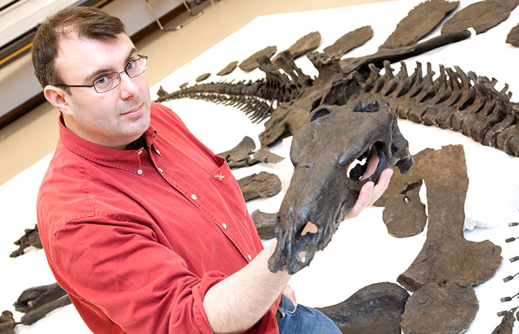 Paul Barrett with Sophie the Stegosaurus at the Natural History Museum in London