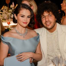 Selena Gomez in a light blue gown and Benny Blanco in a white suit at the 2025 Golden Globe Awards