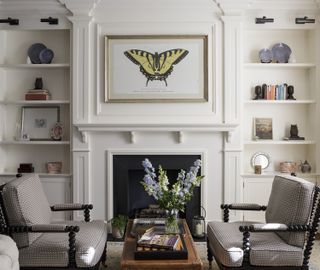 transitional living room with white walls yellow art and grey furniture