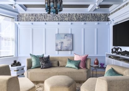 A living room with light blue walls and a brown sofa