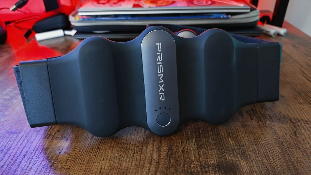 The PrismXR Carina charging belt sitting on a desk