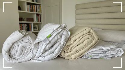 Four of the best duvets - the scooms down duvet, Silentnight half and half, Woolroom washable duvet, and IKEAs on a bed