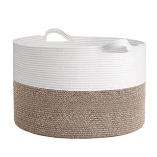 A circular storage basket with a white and brown stripe