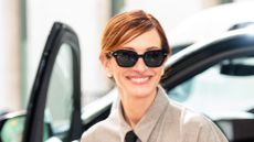 Julia Roberts wearing shirt dress, black tie and black Jimmy Choo heels on September 26, 2025 in New York City