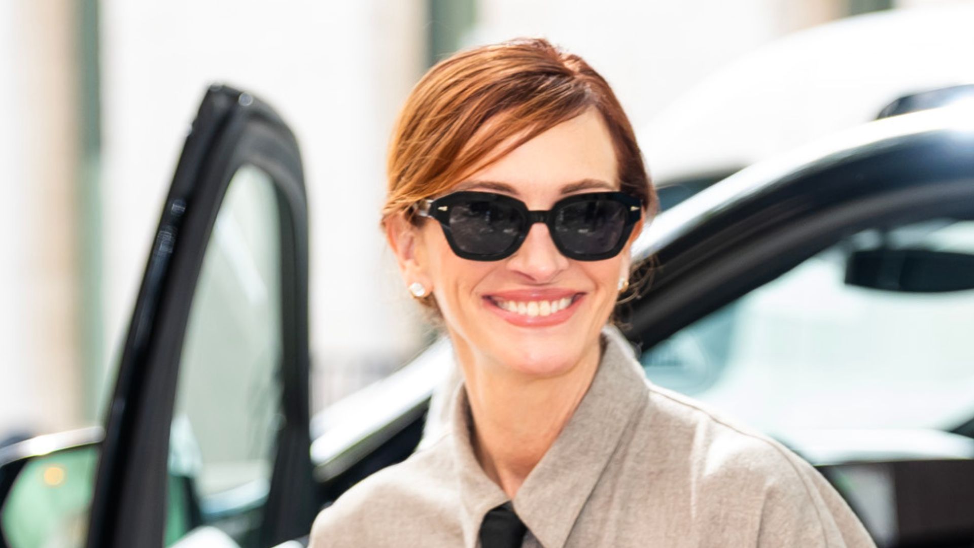 Julia Roberts wearing shirt dress, black tie and black Jimmy Choo heels on September 26, 2025 in New York City