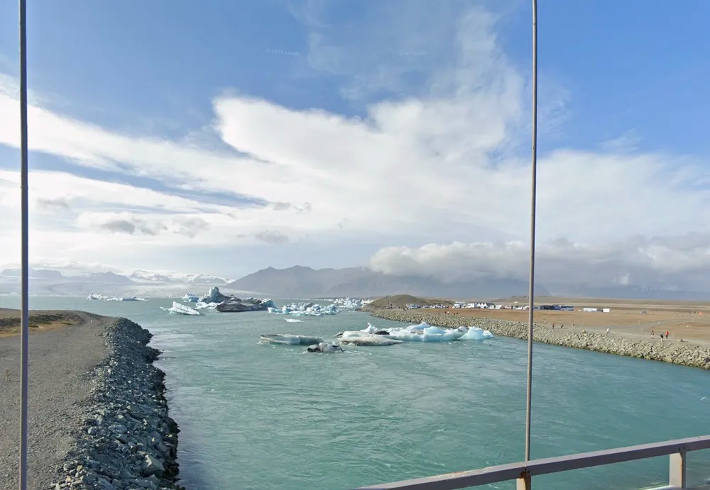 Street View imagery taken from the bridge overlooking Diamond Beach in southeast Iceland, where icebergs float in the water.