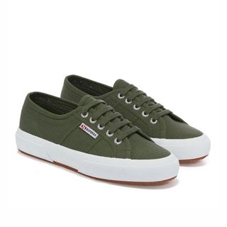 Flat lay image of olive coloured trainers