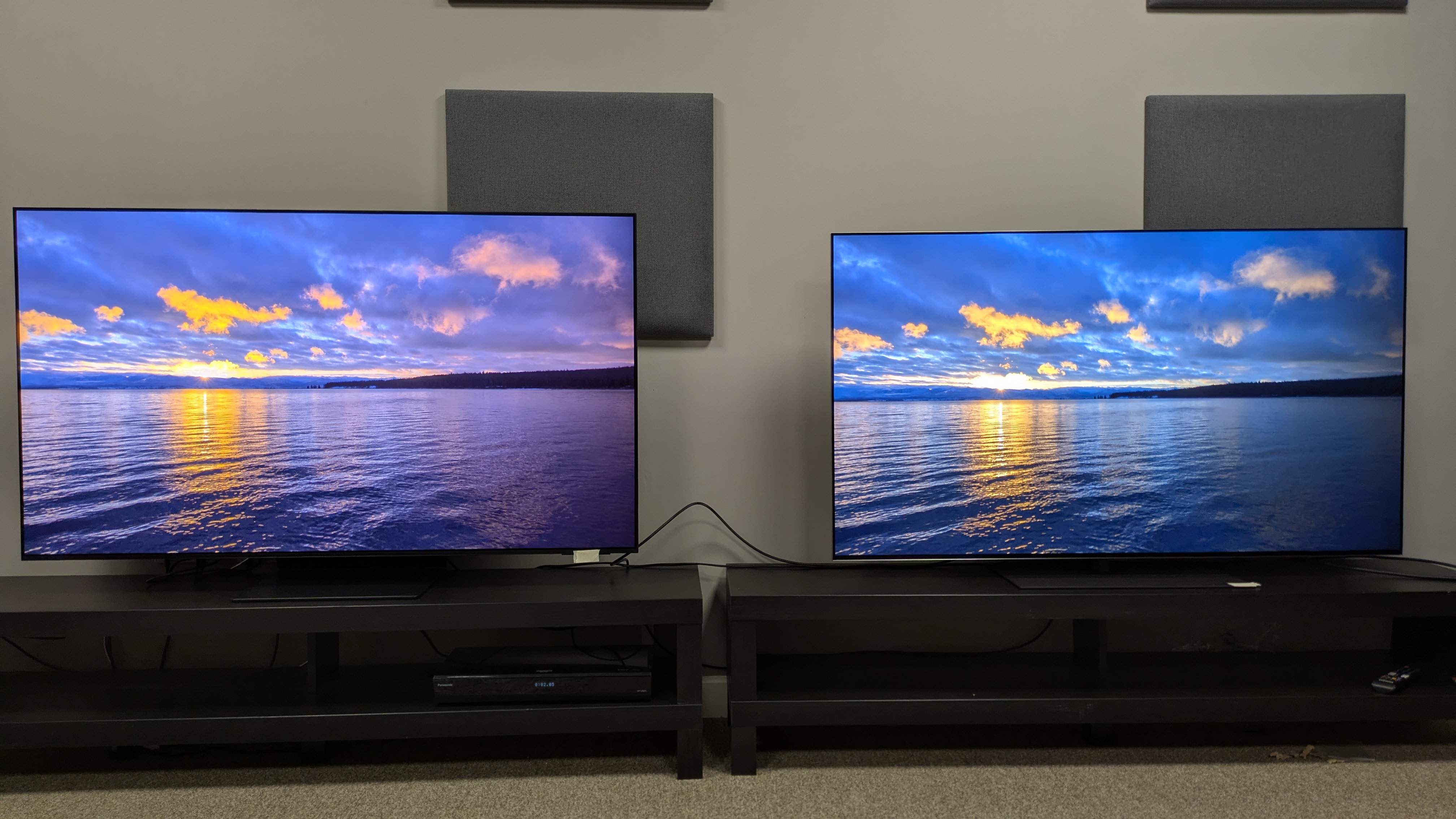 Samsung S95F vs LG G5 showing sunset over lake on screen