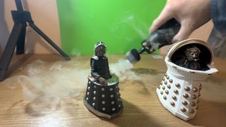 Telesin C40 Portable Smoke Machine creating smoke around two Doctor Who toys