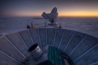 The Background Imaging of Cosmic Extragalactic Polarization 2 (BICEP2) experiment, shown here in the foreground, studies the cosmic microwave background from the South Pole, where cold, dry air allows for clear observations of the sky. In March 2014, the BICEP2 team announced that they had seen evidence of gravitational waves, offering what seemed to be "smoking gun" evidence of inflation. Although a Planck-BICEP2 joint analysis has since shown that dust in the Milky Way had mimicked the signal expected from gravitational waves, future experiments may yet discover these long-sought waves. The project was funded by $2.3 million from W. M. Keck Foundation, as well as funding from the National Science Foundation, the Gordon and Betty Moore Foundation, the James and Nelly Kilroy Foundation and the Barzan Foundation.