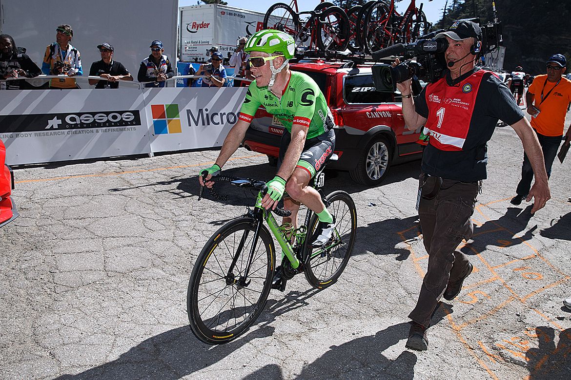 Andrew Talansky gets directions to the podium after his win