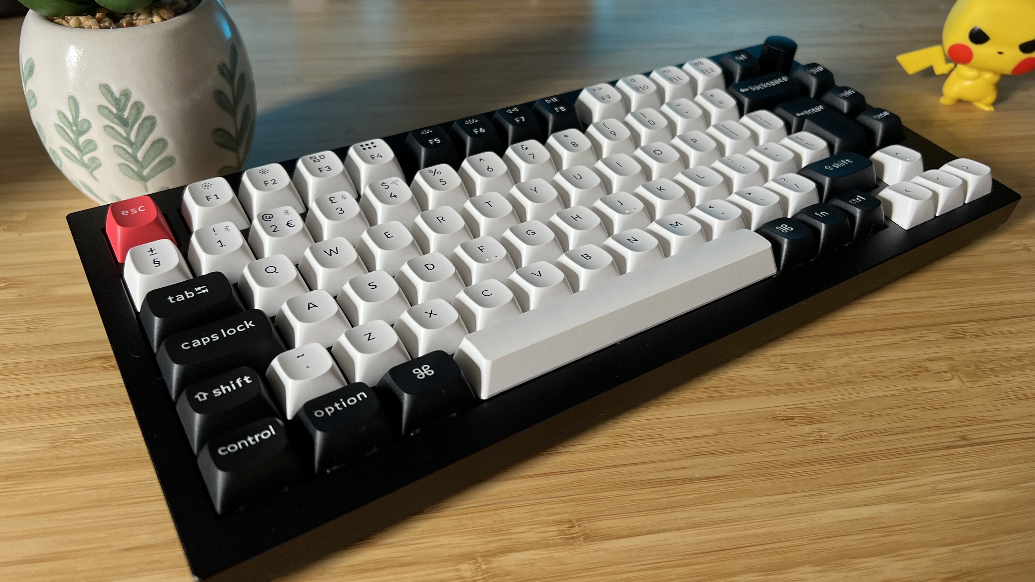 Keychron Q1 KE gaming keyboard on a wooden desk