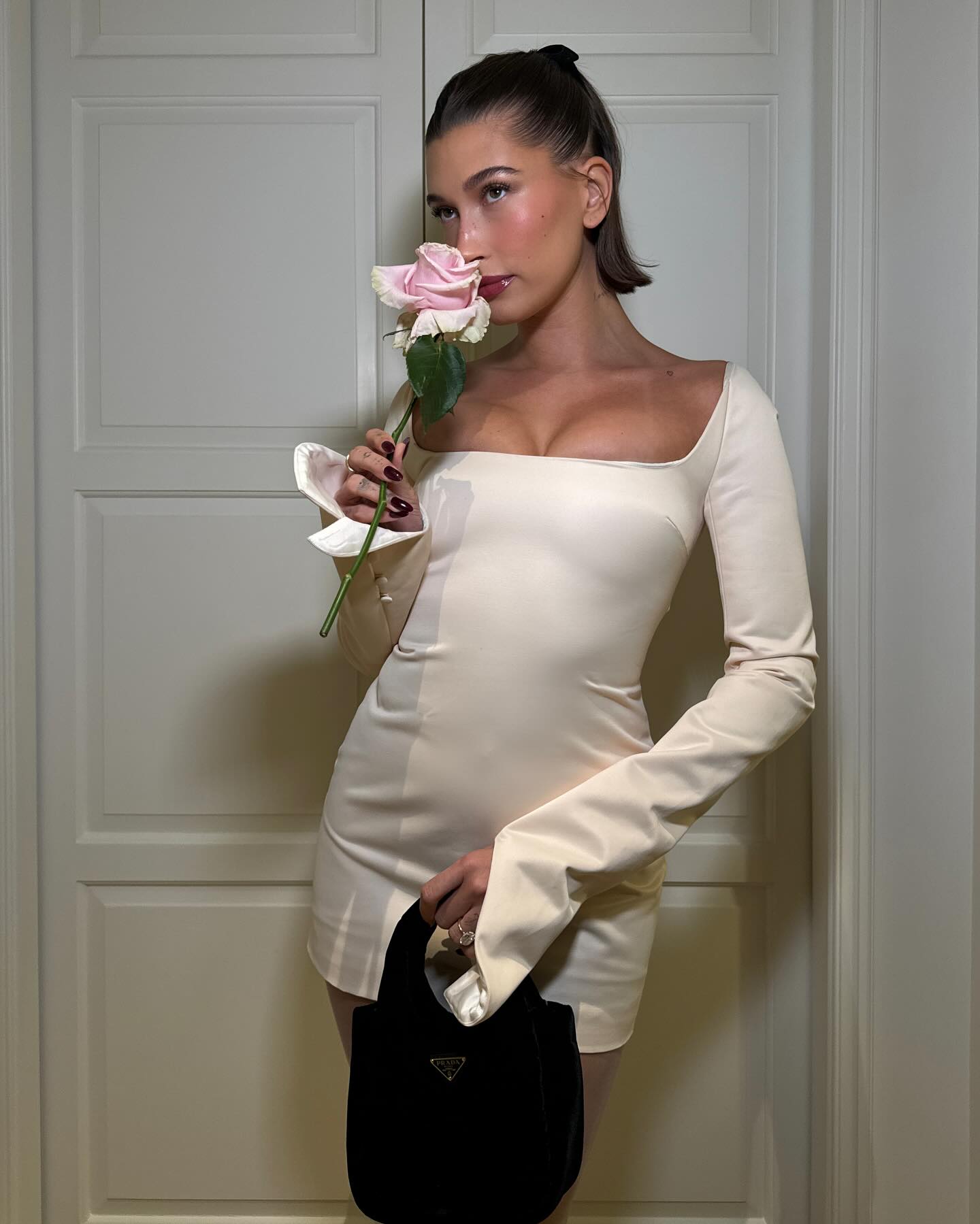 Hailey Bieber wearing a half-up, half-down style.