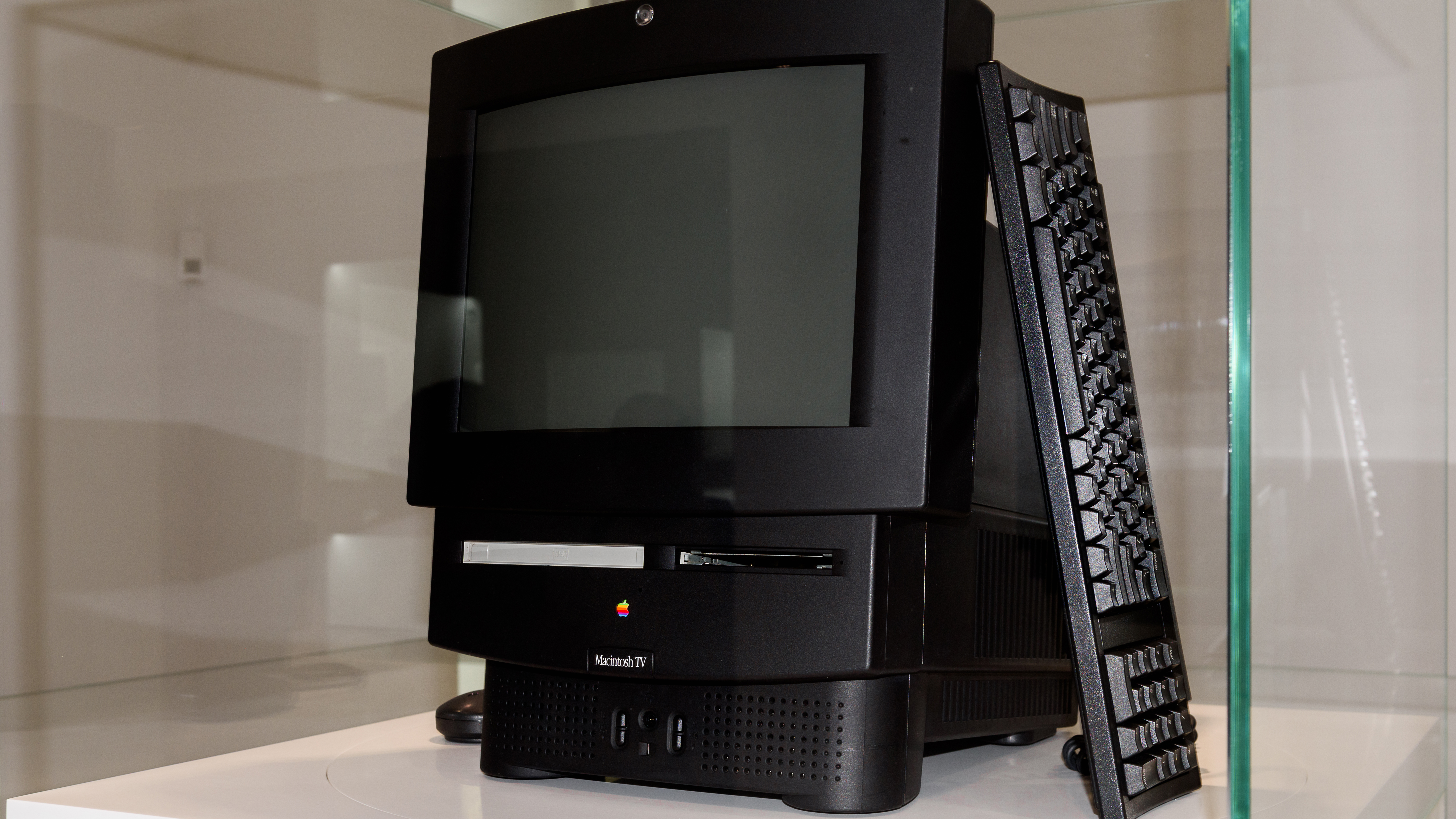 The Macintosh TV sitting in a glass case
