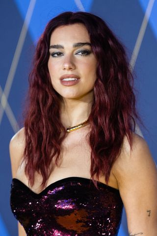Dua Lipa is pictured with dark red hair, whilst attending the World Premiere of "Argylle" at the Odeon Luxe Leicester Square on January 24, 2024 in London, England.