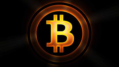 Bitcoin symbol in gold with black background