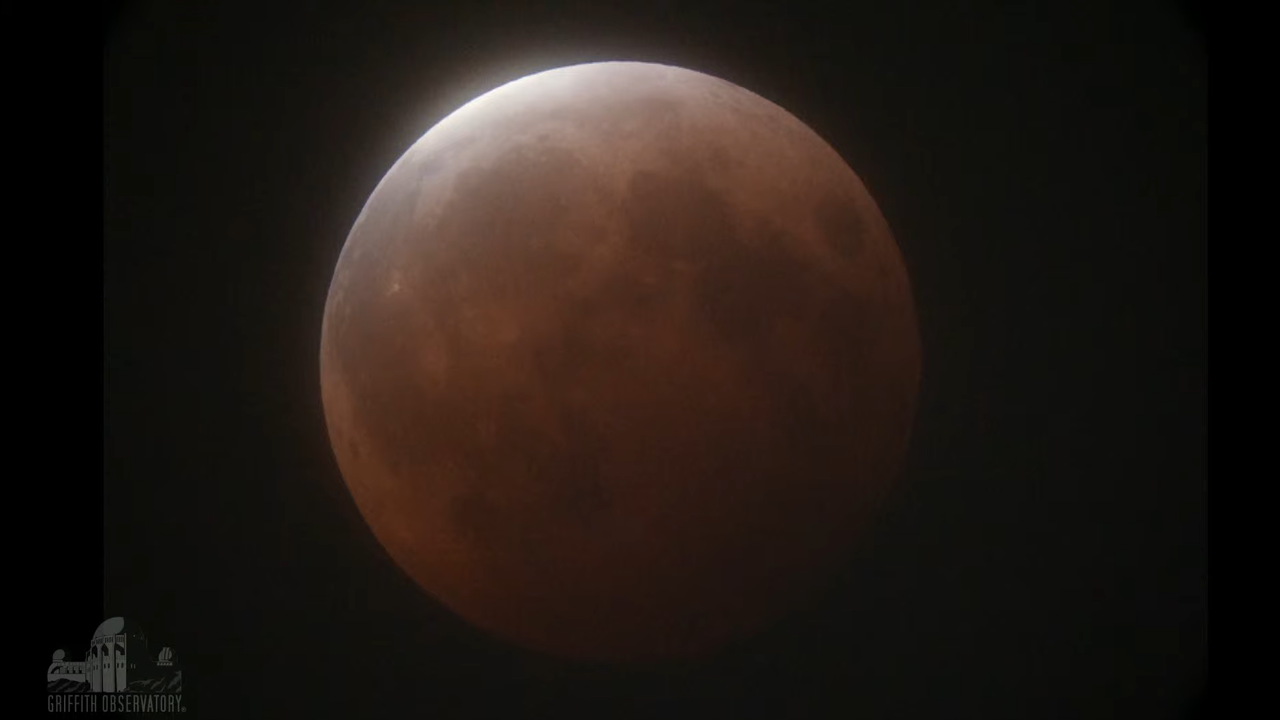 The full moon on May 26, 2021, just as totality of the lunar eclipse was ending, as seen from Griffith Observatory near Los Angeles.