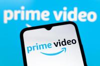The Amazon Prime Video logo appears on the screen of a smartphone and in the background on the computer screen in Reno, United States, on December 15, 2024. (Photo by Jaque Silva/NurPhoto)