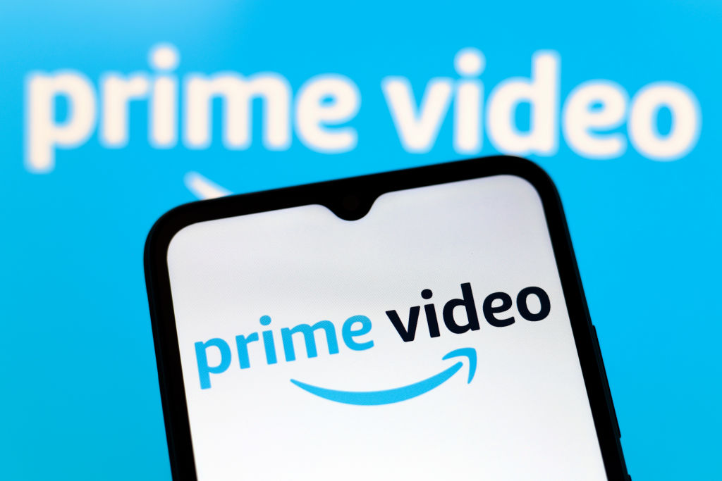 The Amazon Prime Video logo appears on the screen of a smartphone and in the background on the computer screen in Reno, United States, on December 15, 2024. (Photo by Jaque Silva/NurPhoto)