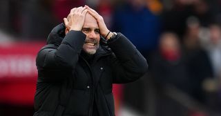 Pep Guardiola, manager of Manchester City looks dejected during the Premier League match between Manchester United and Manchester City at Old Trafford on January 14, 2023 in Manchester, England.