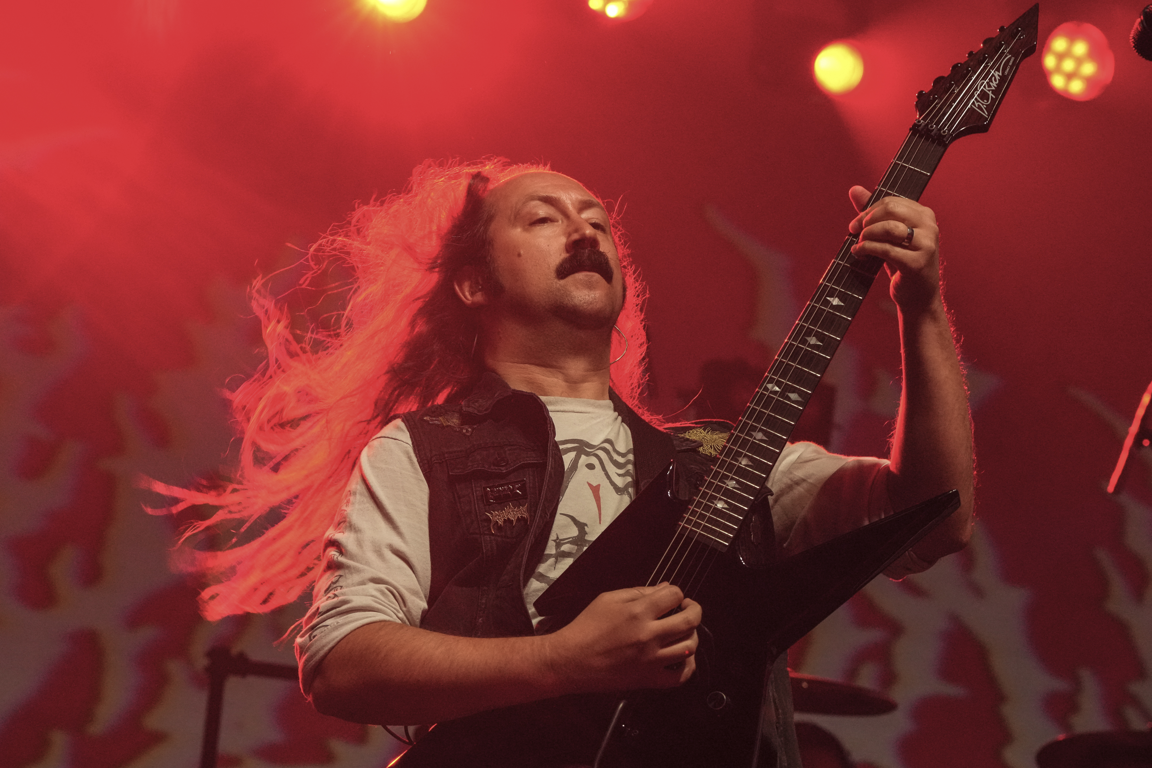 Paul Riedl of Blood Incantation onstage in 2025